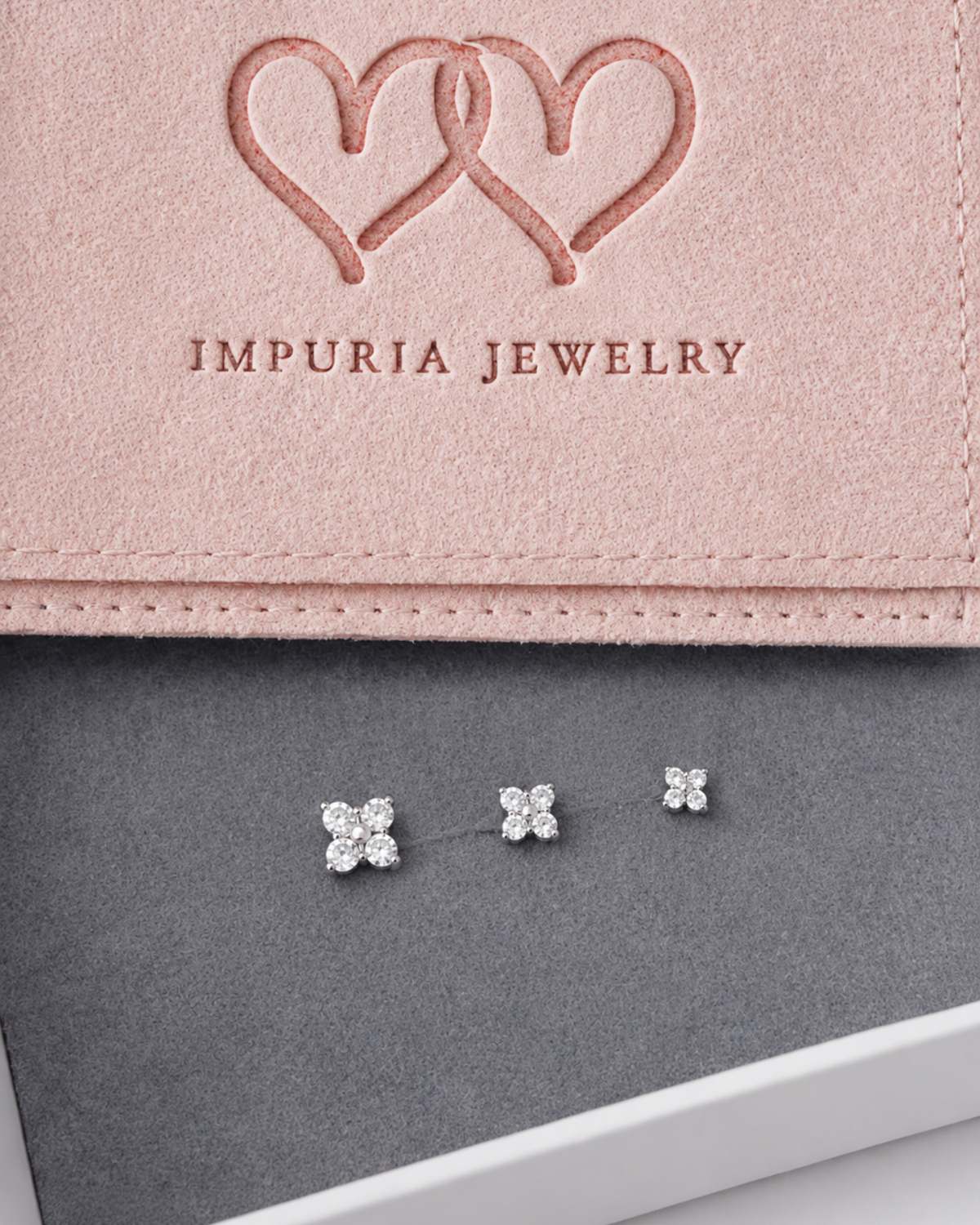 Clover flat back earring stud available in multiple sizes, designed for everyday wear and various ear piercing placements.