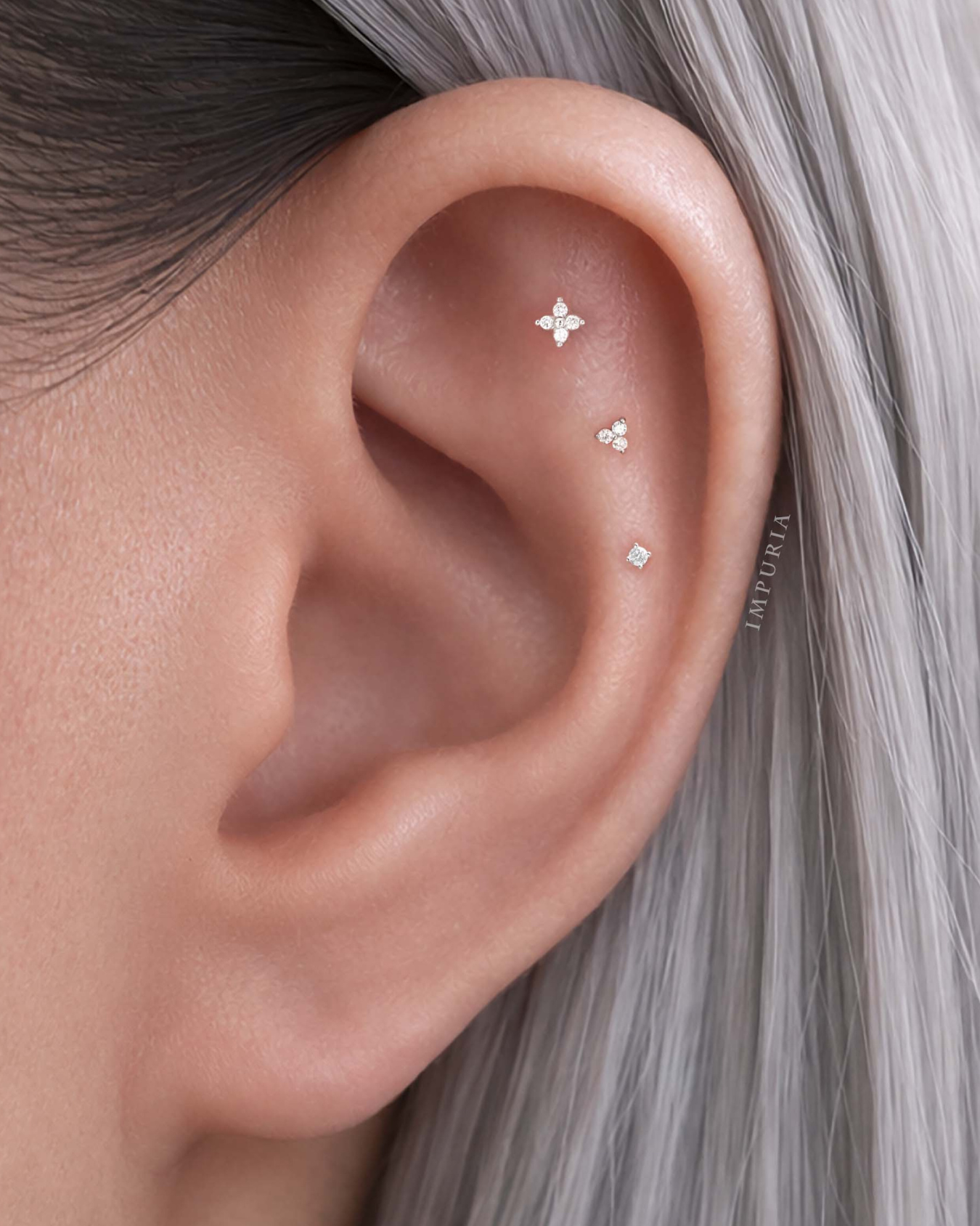 Surgical steel clover flat back stud earring styled in a flat piercing with a polished clover top tapered styling