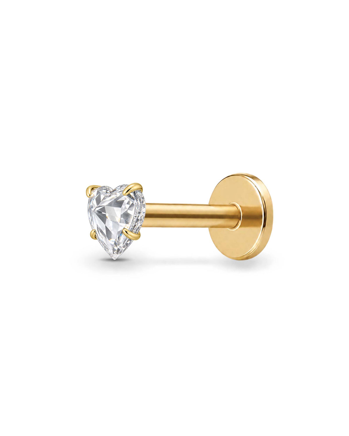 A gold toned labret piercing stud with a heart-shaped clear gemstone, shown against a plain white background.