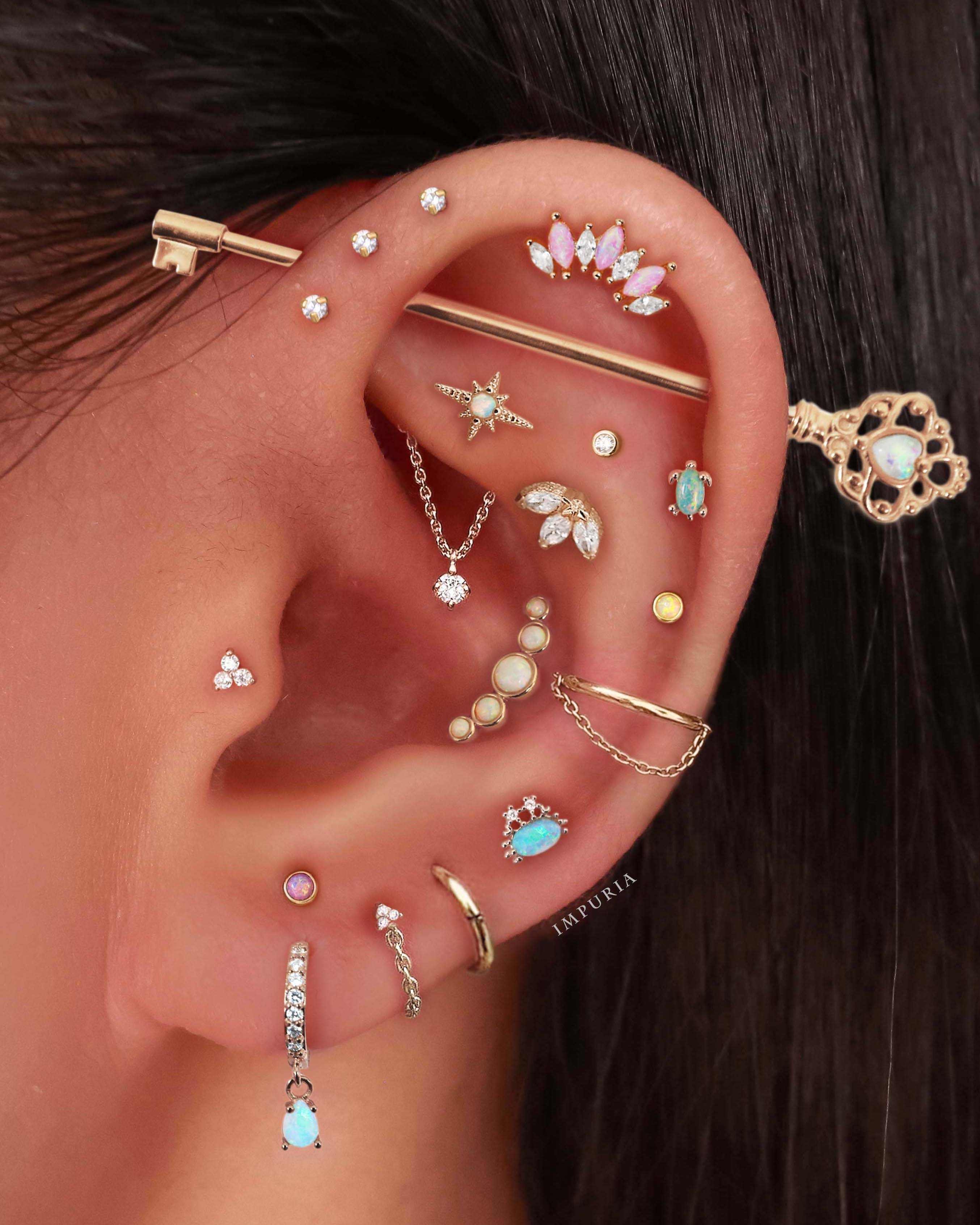 Cute Multiple Ear Piercing Ideas for Women Gold Sun Starburst Cartilage Earrings - www.Impuria.com #earpiercings