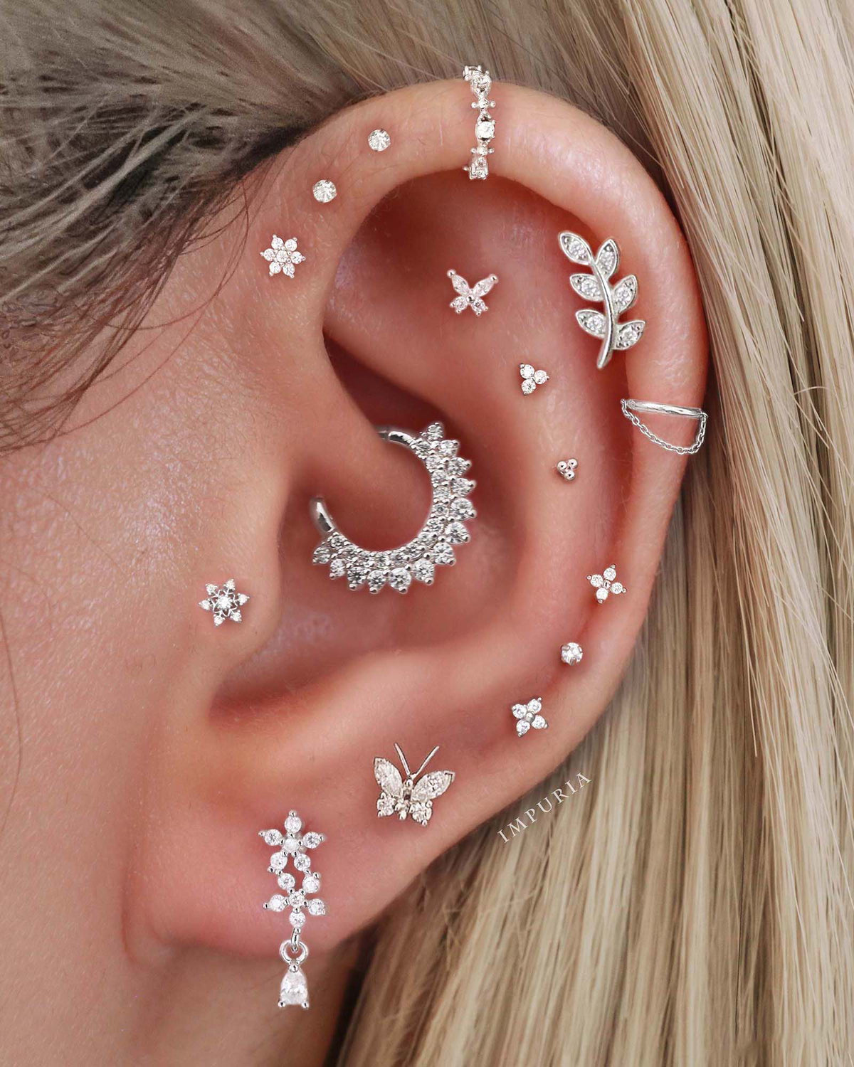 Cute stacked multiple ear curation piercing ideas for women - conch hoop earrings - www.Impuria.com #earpiercings