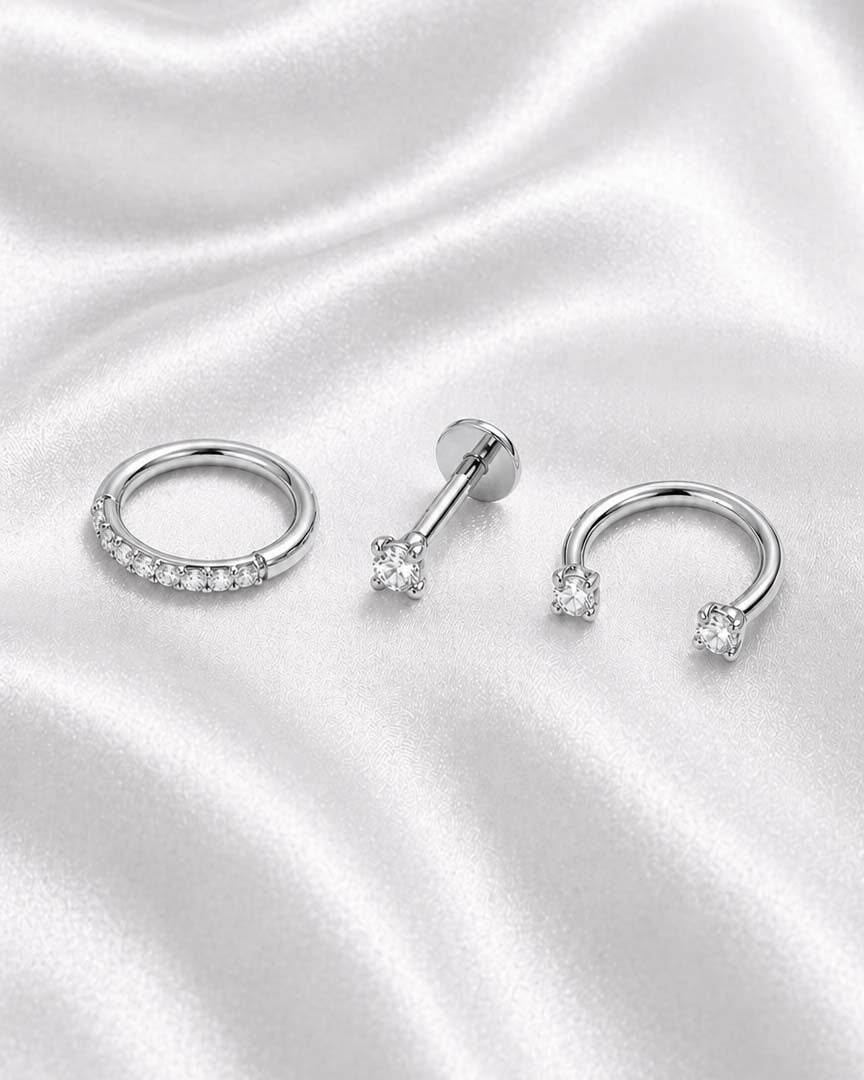Minimalist ear stack with flat back stud earrings and helix hoop and horseshoe barbell, Essential Ear Stack Capsule by Impuria jewelry in silver