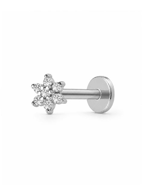 A silver-toned flat-back labret stud earring featuring a small six-petal snowflake cluster with clear cubic zirconia stones, shown against a plain white background.