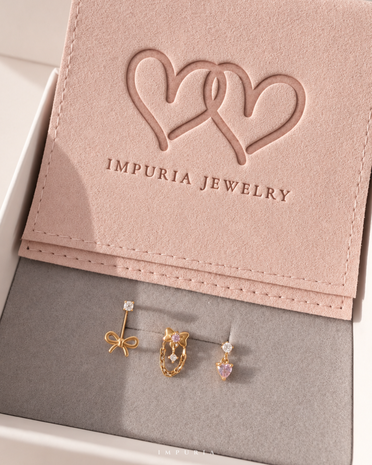 amour coquette bow heart earring stack capsule in gold by impuria jewelry