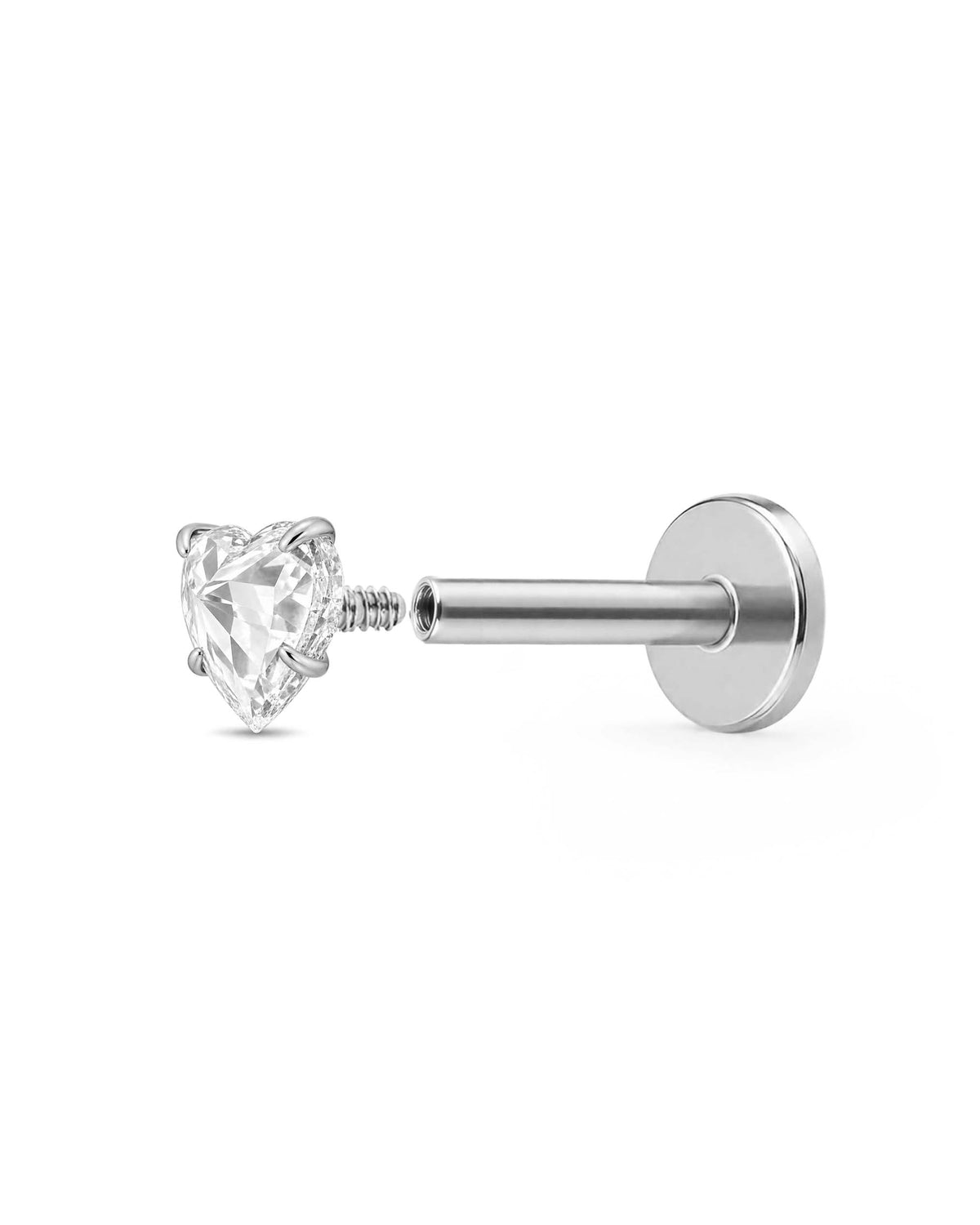 A silver-toned labret piercing stud with a heart-shaped clear gemstone open internally threaded barbell, shown against a plain white background.