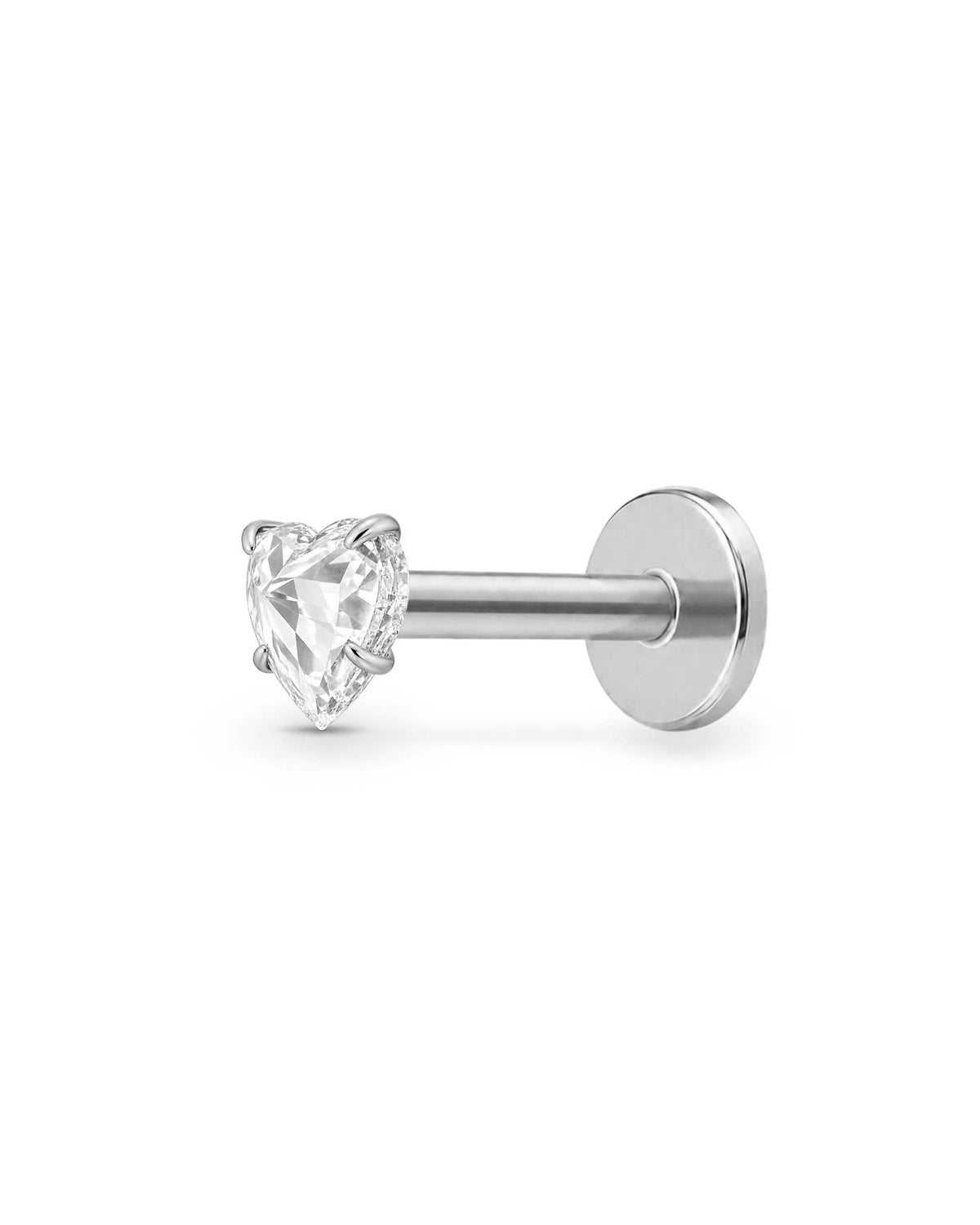 A silver-toned labret piercing stud with a heart-shaped clear gemstone, shown against a plain white background.