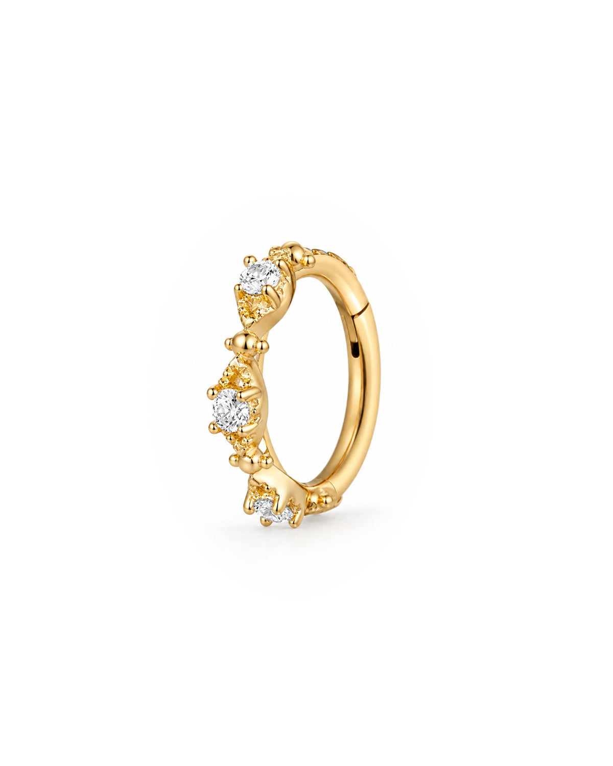 A gold migraine hoop ring clicker decorated with four small clear gemstones in a prong setting, shown on a plain white background.