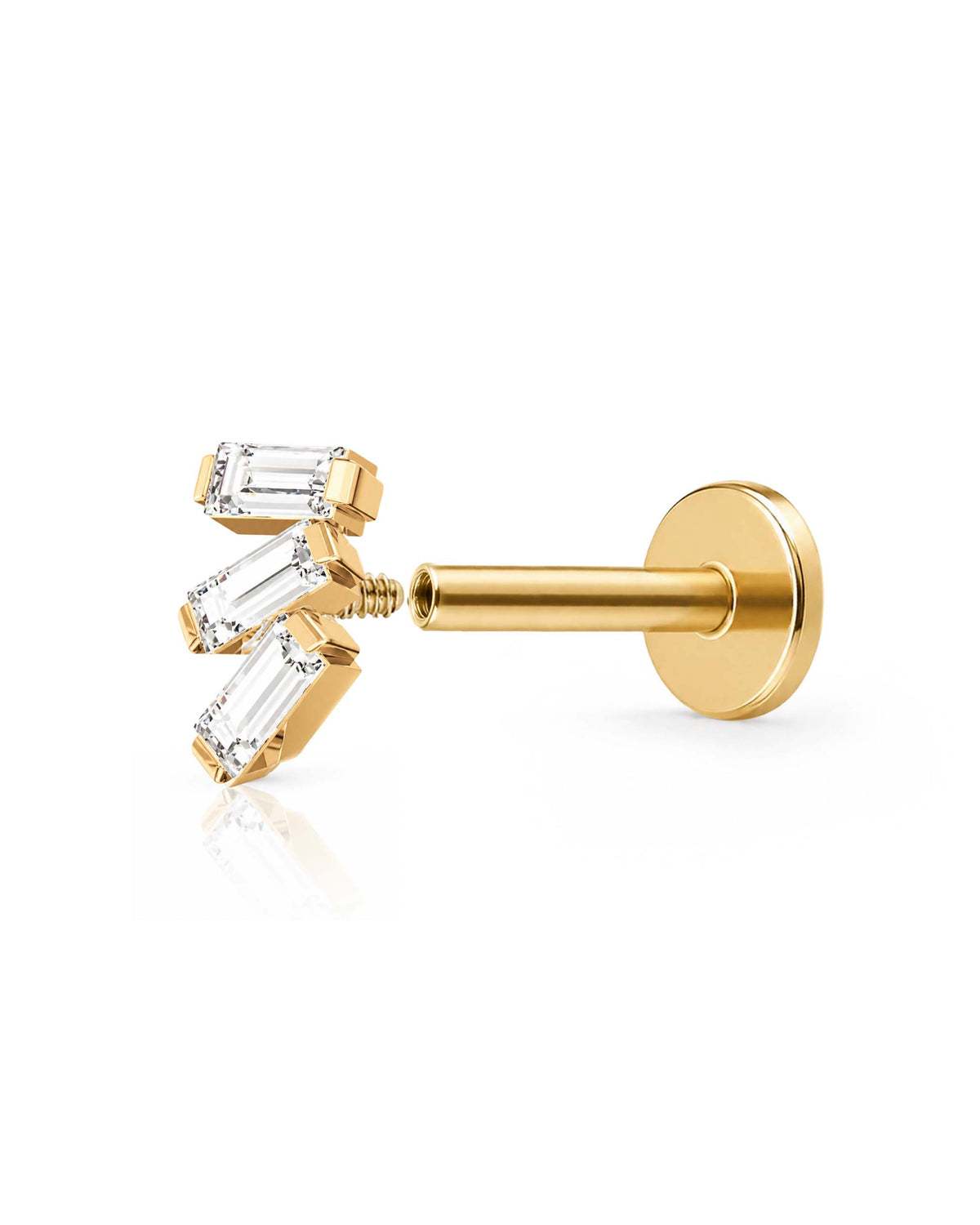 A gold post piercing stud with three baguette-cut clear gemstones, shown from a side profile on a clean white background with a soft reflection open internally threaded.