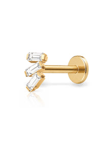 A gold post piercing stud with three baguette-cut clear gemstones, shown on a clean white background with a soft reflection.