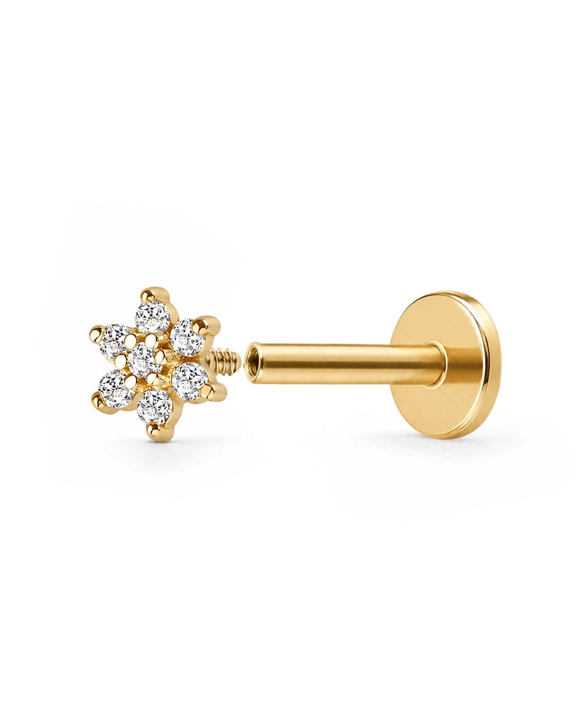 A gold floral stud earring with a six-petal flower head set with clear gemstones and a straight post with a flat back opened, shown on a plain white background.