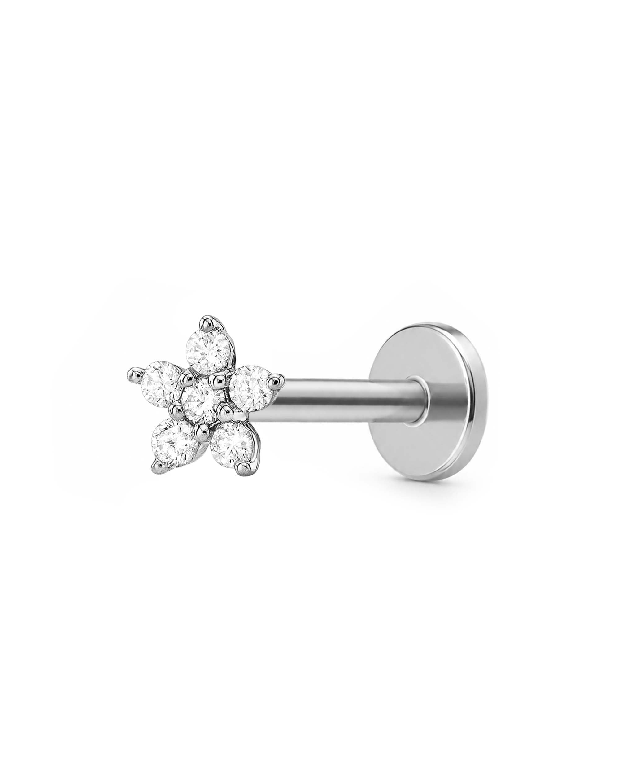 A silver-toned flat-back labret stud earring featuring a five-petal flower cluster set with clear round-cut gemstones, shown against a plain white background.