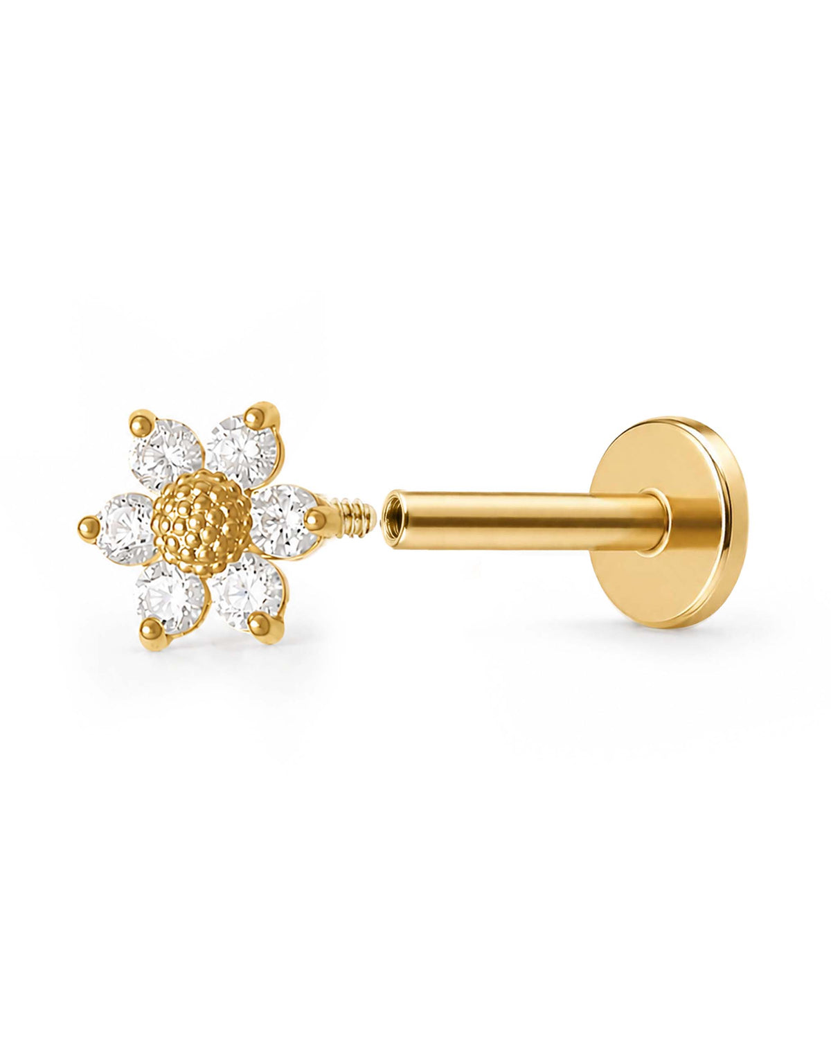 A gold open sunflower labret stud earring with clear gemstone petals and a textured gold center, shown on a plain white background.