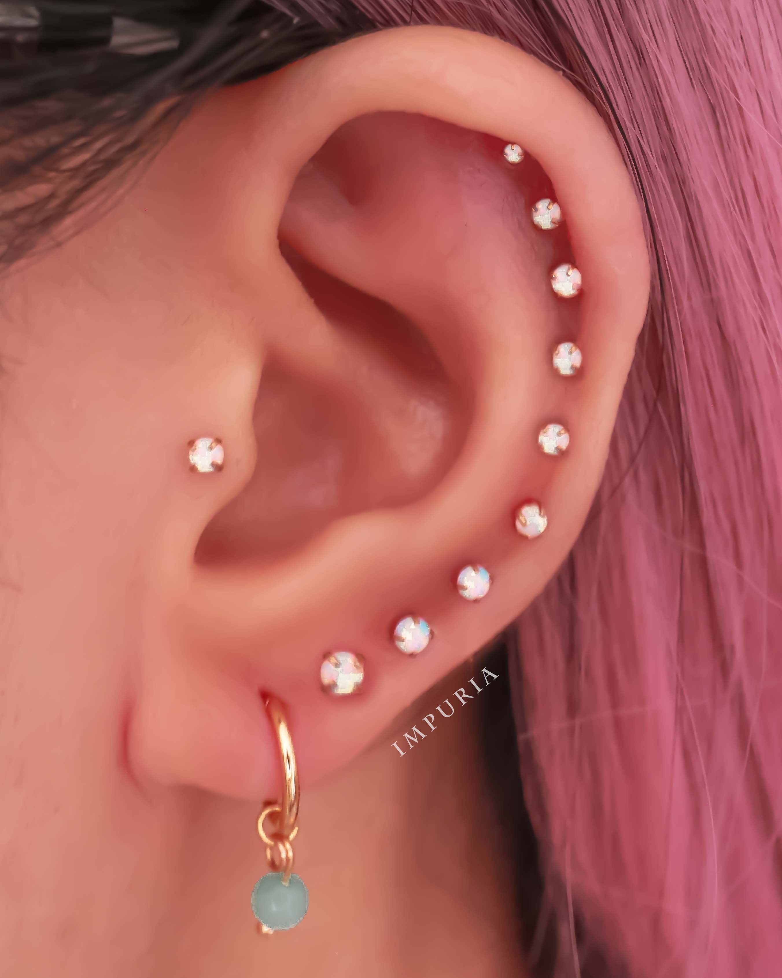 Cute All the Way Around Opal Cartilage Helix Ear Piercing Ideas Curations - www.Impuria.com #earpiercings