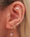 Unique ear piercing ideas for women purple cartilage helix conch lobe tragus earring studs -Ideas para perforar la oreja - www.Impuria.com
