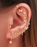 Cute butterfly ear curation piercing ideas for women - conch hoop earrings - www.Impuria.com